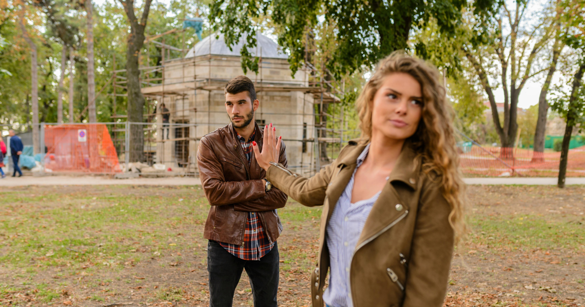 Overcoming Failure: Rejection and moving on from relationship issues - Los Angeles Mental Health Overcoming Failure: Woman rejecting man, symbolizing relationship issues and moving on from the feeling of failure.