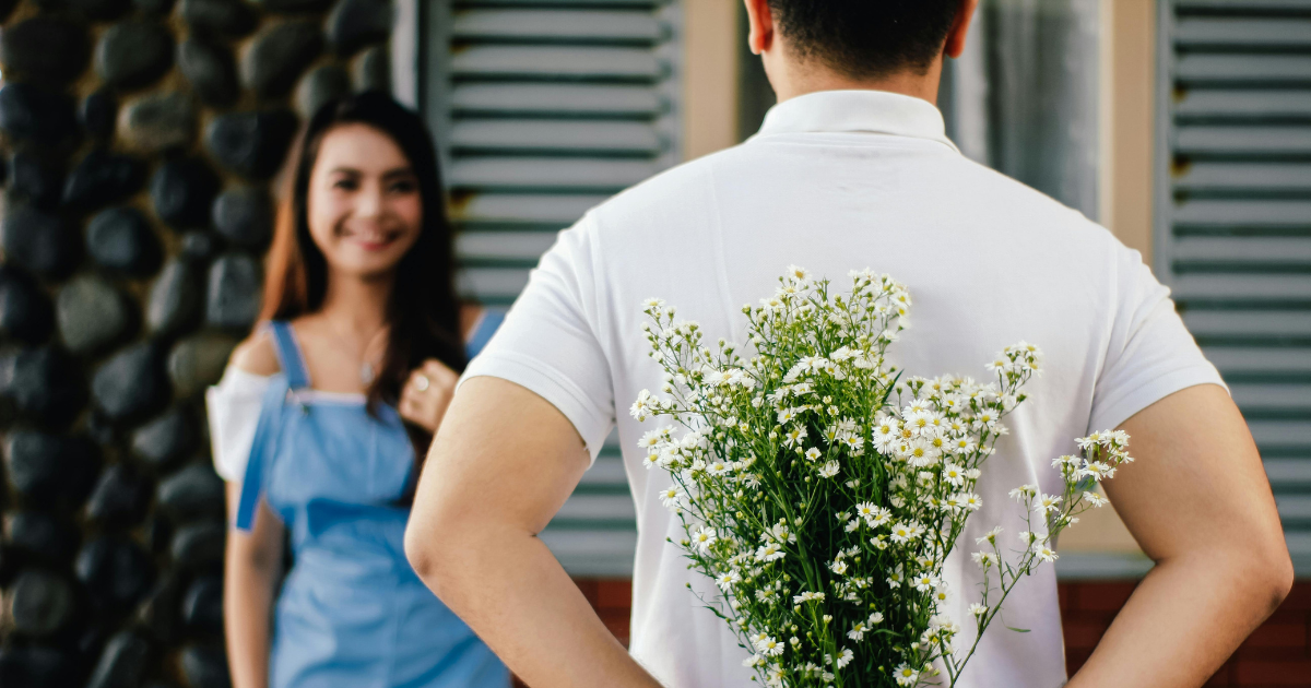 Cyberchondria help: Man hiding flowers for woman, managing health anxiety, improving mental wellness, and building healthy relationships.