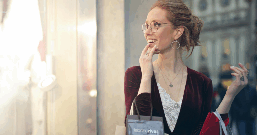 Supporting a loved one with depression: Woman smiling with shopping bags. Showing care and compassion.